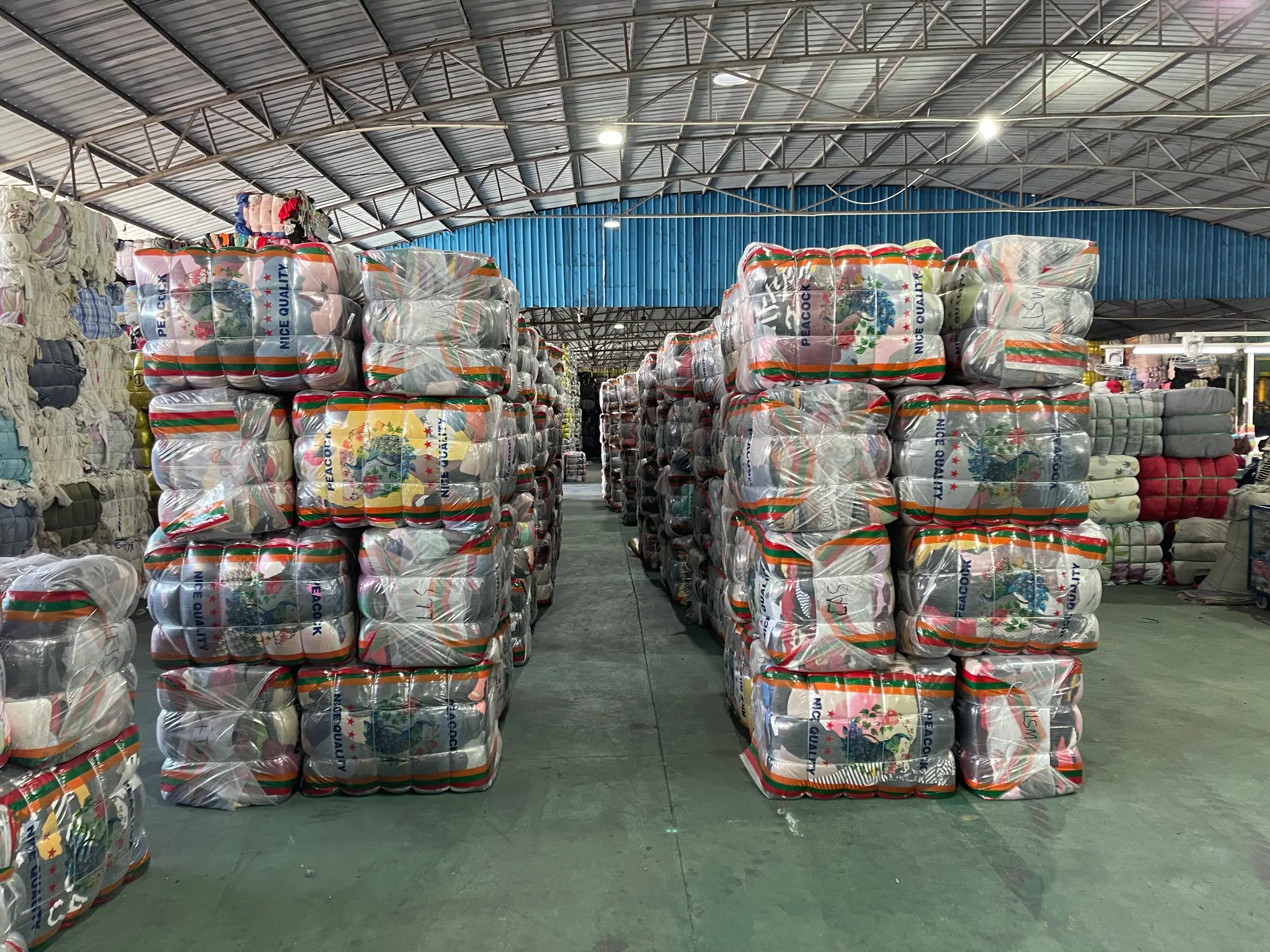 Factory storage with stacked clothing packages
